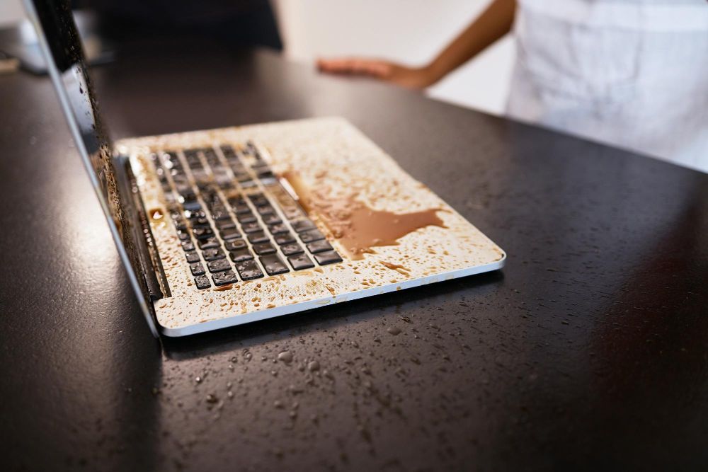 coffee splash on laptop